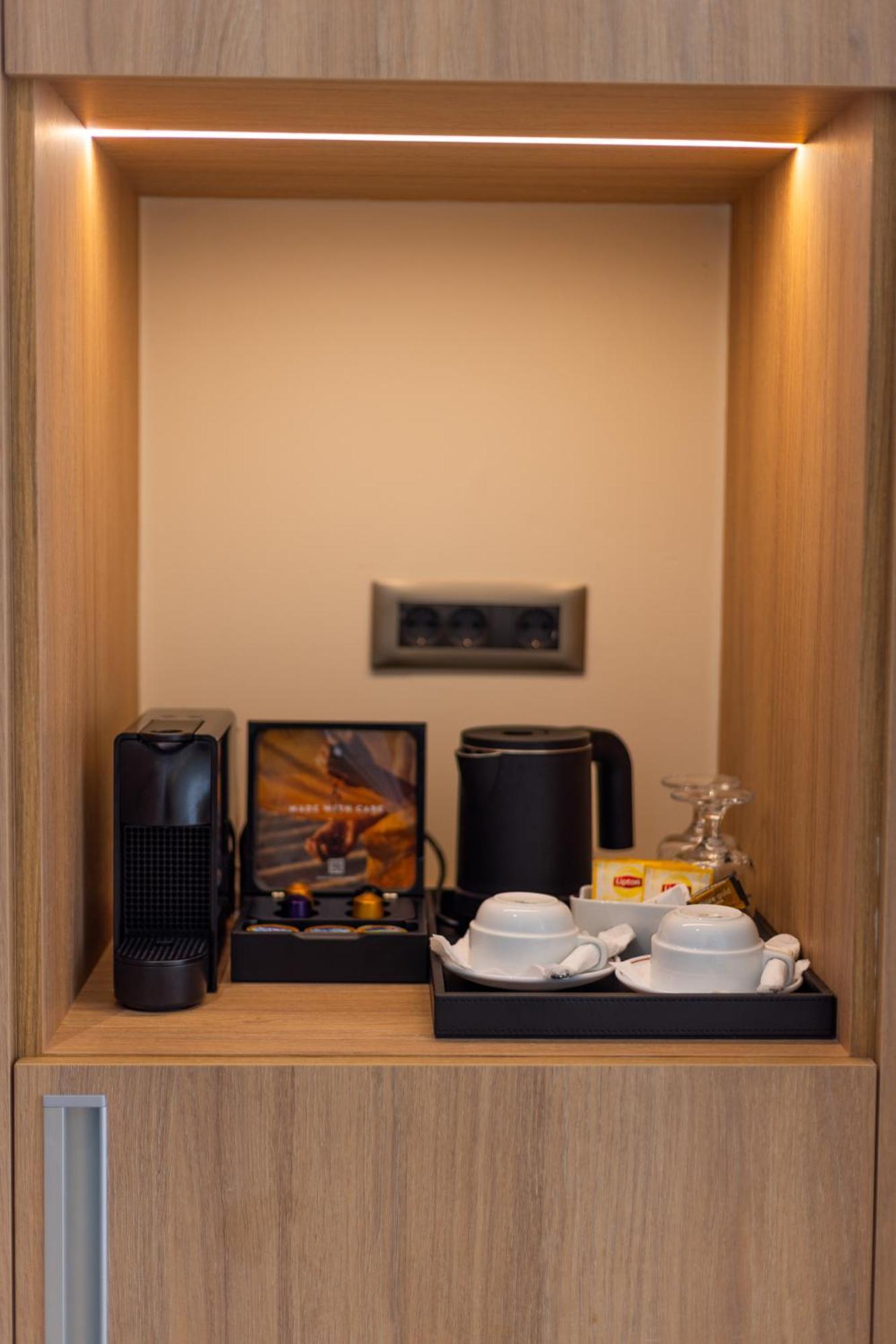 Pegasos Deluxe Beach Hotel Faliraki Exterior foto A Nespresso coffee machine in a hotel room